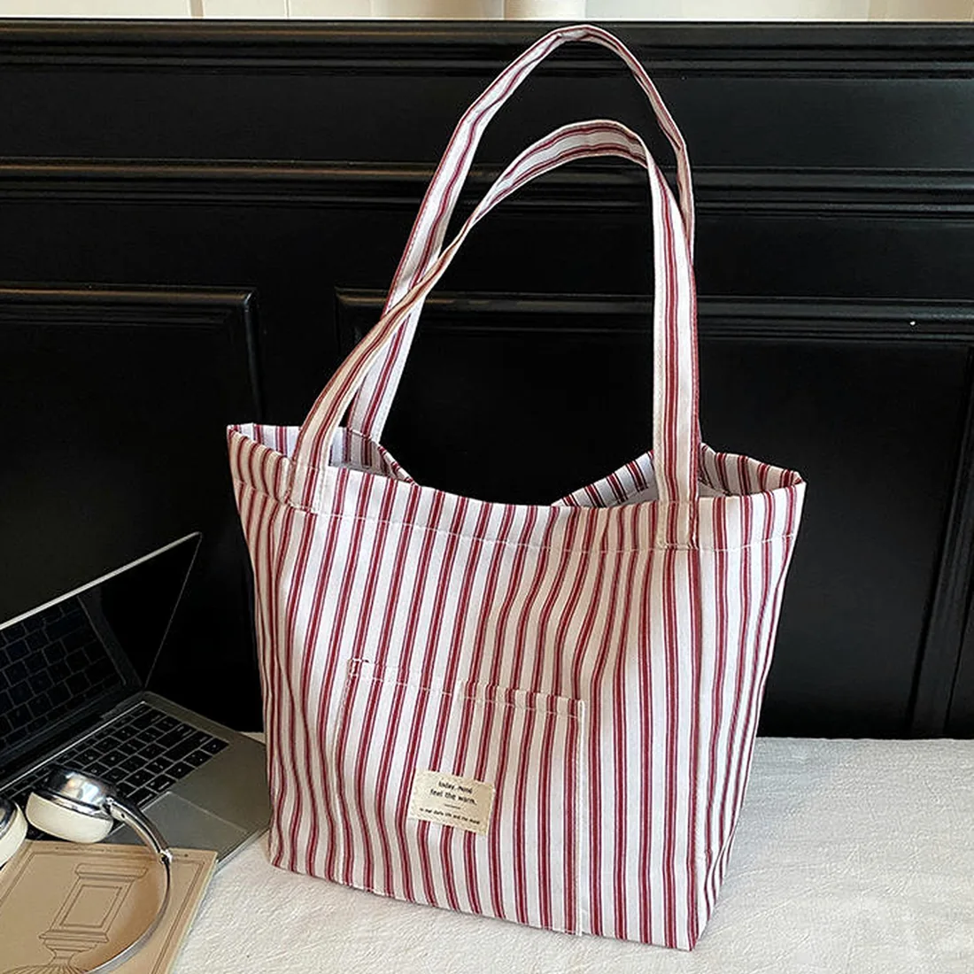 Striped canvas shopping bag styled with everyday objects